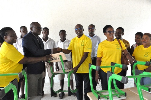 Dr Agbodza (middle in spectacles), President of OMSU’83 presenting the furniture to Benjamin Yawo Dei, headmaster of Mawuli School, Ho, while Celestine Quarm, Chief Revenue of Customs and Vice President and other executive members of the year group look on.