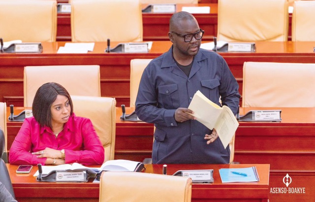 Francis Asenso-Boakye (right), Minister of Roads and Highways, making a submission in Parliament
