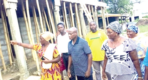  Manye Maku I, Manya Krobo Divisional Queenmother, with the committee members taking the media around the project.