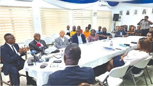  Dr John Kwakye (left), Director of Research, IEA, explaining some issues to stakeholders at the forum