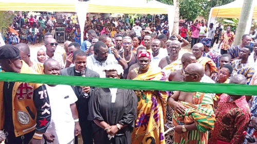 Magdalene Cobbina inaugurating the facility. INSET: Frontage of the maternity block