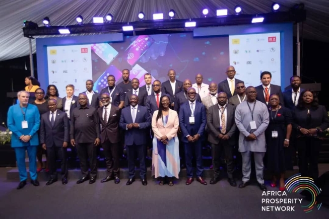 Dr Mahamudu Bawumia (5th from left) Vice-President, Gabby Asare Otchere Darko (4th from left), Executive Chairman and  Founder,  Africa Prosperity Network; Dr Ernest Addison (3rd from left), Governer, Bank of Ghana; Ursula Owusu-Ekuful (middle), Minister of Communication and Digitalisation, and other dignitaries at the symposium in Accra