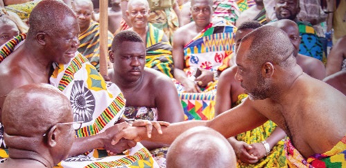  Dr Matthew Opoku Prempeh (right) paying homage to Otumfuo Osei Tutu II, the Asantehene 