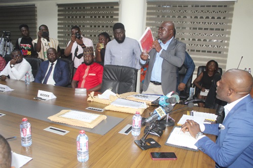 Anthony Osei (2nd from right), Director of Procurement, Ministry of Works and Housing, displaying the five bidding companies.  With him is Kojo Oppong Nkrumah (right), Minister of Works and Housing; Dr Prince Hamid Armah (left), Deputy Minister of Works and Housing, and other participants.  Picture: ESTHER ADJORKOR ADJEI 