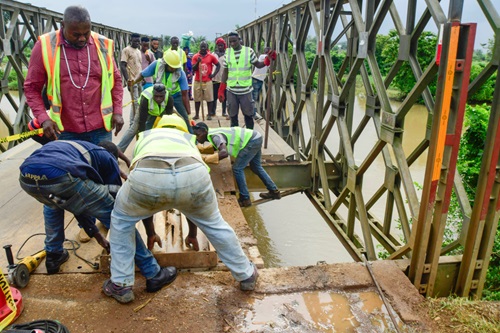 Engineers repairing the bridge