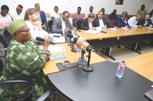 Emmanuel Nene Martey (left), Chairman, Ghana Chamber of Construction, explaining a point to stakeholders and the media at the discussion in Accra. Pictures: SAMUEL TEI ADANO