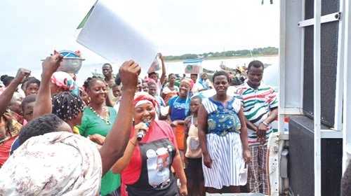 Cynthia Afeafa Woayor (with mic), Deputy Volta Regional Women's Organiser, addressing the gathering