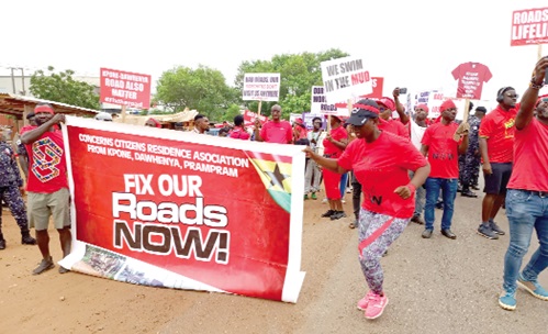 A cross-section of the protesters during the march.  INSET: Policemen were dispatched in their numbers to oversee the march