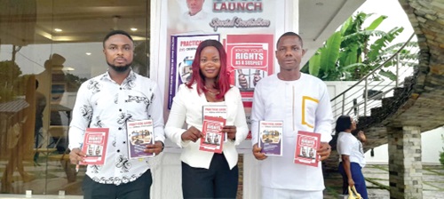 Detective Sergeant Modestus Amevor (right), author of the books; Israel Kpodo (left), Volta and Oti Regional Head of Corporate Affairs of Complementary Education, and Agnes Dariha (middle), wife of Sergeant Amevor, with the new 