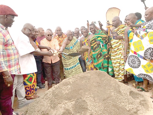 President Akufo-Addo (4th from left) being assisted by Akyeamfuor Boakye Agyemang-Bonsu II (middle), Asafohene, to cut the sod for the commencement of the dualisation of the Ahenema Kokoben- Anwiankwanta road at Pakyi No.1 in the Ashanti Region. Picture: EMMANUEL BAAH