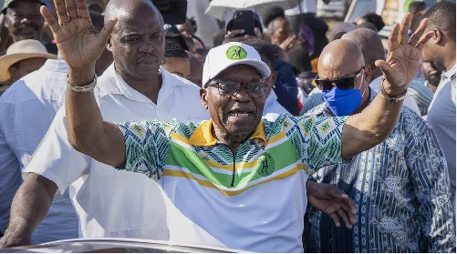 FILE - Former president of the A.N.C. and South Africa, Jacob Zuma, waves to supporters after casting his ballot in Nkandla, Kwazulu Natal