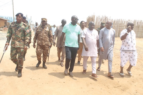  Inset: Nii Adjei Kwoofeh IV (2nd from right), Member of the La Traditional Council, interacting with Daniel Nii Kwartei Titus-Glover (3rd from right), Greater Accra Regional Minister, during the visit to Laboma Beach, close to the Kpeshie Lagoon at Teshie in Accra. Picture: ESTHER ADJORKOR ADJEI