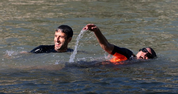 Ms Ann Hidalgo (right) and Tony Estanguet, president of the Paris 2024 Olympic and Paralympic Games Organising Committee, in the water.