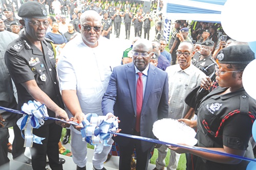 Dr Mahamudu Bawumia (3rd from right), being assisted by Henry Quartey (2nd from left), Minister for the Interior, and Dr George Akuffo Dampare (left), IGP, to cut a tape for the inauguration of the Police shop. Picture: DOUGLAS ANANE-FRIMPONG
