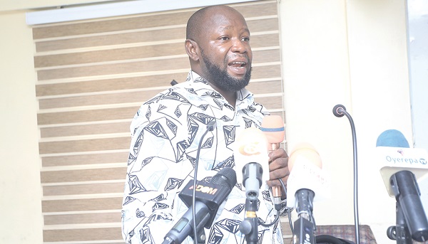 Karim Saagbul (inset), Organiser, Accra Focal City, WEIGO,  presenting the report. Pictures: BENEDICT OBUOBI 