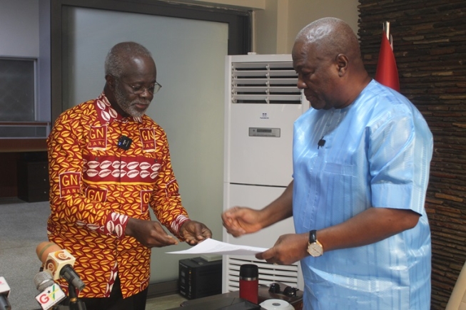 Dr Paa Kwesi Nduom (left), Global President of Groupe Nduom, presenting the petition to John Dramani Mahama, NDC flag bearer. Picture: ESTHER ADJORKOR ADJEI