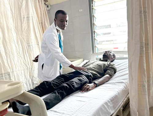 Dr Amoah examining a patient on one of the wards at the Korle Bu Teaching Hospital Dr Amoah examining a patient on one of the wards at the Korle Bu Teaching Hospital