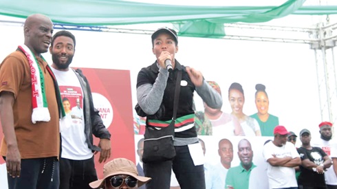 Dr Zanetor Agyeman-Rawlings, the MP for Korle Klottey,  addressing the crowd after the "Get Fit and Ready Mahama Walk" as Haruna Iddrisu (left), MP for Tamale South,  and her brother,  Kimathi Rawlings, look on