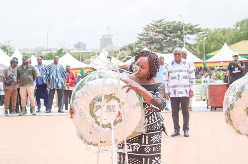 Professor Naana Jane Opoku-Agyemang laying a wreath as former President John Mahama waits for his turn