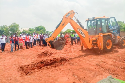 Rev. Dr Stephen Wengam (behind the controls), General Superintendent of the Assemblies of God Church, Ghana, performing the sod cutting to kick-start the project. He is being assisted by Eric Seddy Kutortse (right), Executive Chairman of First Sky Group. INSET: An artistic impression of the church auditorium. Picture: BENJAMIN XORNAM GLOVER