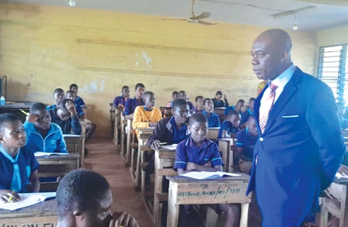 Professor Yayra Dzakadzie, Director-General of NaCCA, observing the pupils at the School for the Deaf at Mampong-Akuapem during the Mathematics paper.