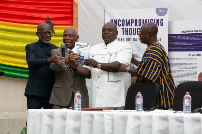 Justice Jones Victor Mawulorm Dotse (2nd from left), retired Justice of the Supreme Court, being assisted by Samuel Koku Anyidoho (2nd from right), author of the book; Dr Kwame Akuffo Anoff-Ntow (right), Media Scholar and Researcher, and Kabral Blay-Amihere (left), Chairman, GRIDCo, to launch the book. Picture: ELVIS NII NOI DOWUONA
