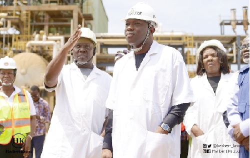 vvHerbert Krapa (middle), Minister of State at the Ministry of Energy, being briefed during the tour