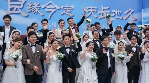 Newly-wed couples attending a group wedding ahead of ’520 I Love You’ Day on May 19, 2024 in Nanning, Guangxi Zhuang Autonomous Region of China.