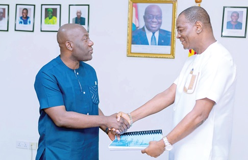 Kojo Oppong Nkrumah (left), Minister of Works and Housing, exchanging the signed documents with Dr Julius Awuni, Managing Director, Hydronomics Limited. Picture: ELVIS NII NOI DOWUONA
