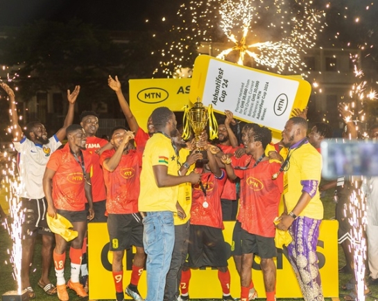 Players of Bantama celebrating with the trophy
