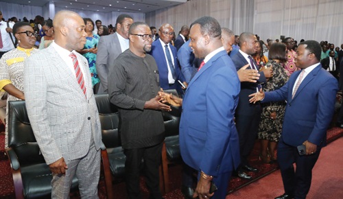 Dr Yaw Osei Adutwum (2nd from right), Minister of Education, and Rev. John Ntim Fordjour (right), a Deputy Minister of Education, exchanging pleasantries at the State of the Education ceremony in Accra. Picture: SAMUEL TEI ADANO