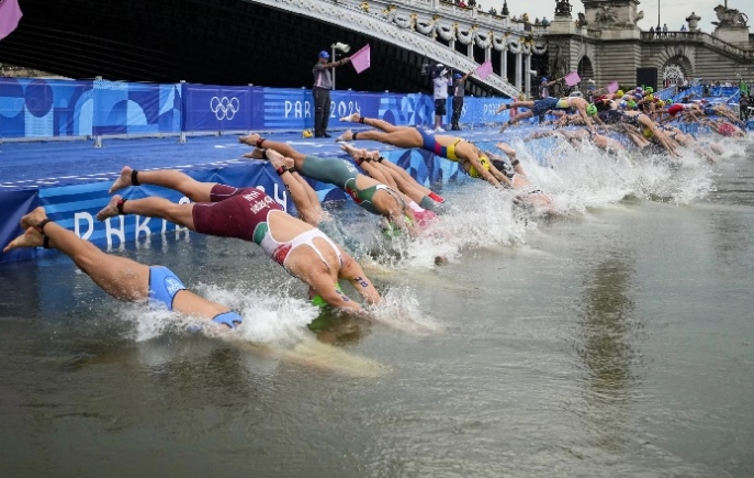 Athletes dived into the water for the start of the women's individual triathlon event