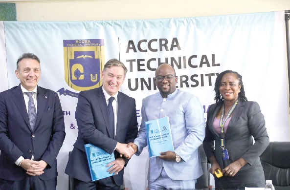 Prof. Amevi Acakpovi (2nd from right), acting Vice-Chancellor of the Accra Technical University, in a handshake with Luciano Scelza, General Manager of Accra Marriott Hotel