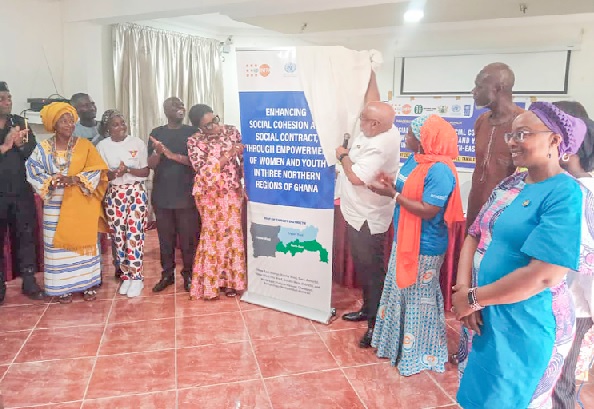 Charles Abani (4th from right), the UN Resident Coordinator to Ghana, being assisted by Dr Angela Lusigi (right), the UNDP Resident Representative, and Shani Alhassan Shaibu (2nd from right), the ­­­Northern Regional Minister, to launch the project
