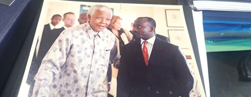 The writer with the late President Nelson Mandela of South Africa The writer with the late President Nelson Mandela of South Africa