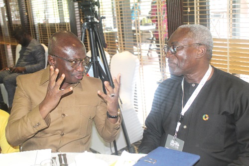 Abdulai Abanga (left), Deputy Minister of Local Government, Decentralisation and Rural Development, interacting with Kodjo Esseim Mensah-Abrampa, Director-General, Development Planning Commission, during the Ghana Urban Forum in Accra. Picture: ESTHER ADJORKOR ADJEI