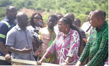 Dr Hadisu Alhassan, Regional Production Manager of Weija Water Treatment Plant, explaining a process to Lydia Seyram Alhassan, Minister of Sanitation and Water Resources, during her visit to the facility