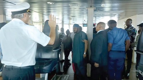 Tommy Steffensen (left), Captain of the Research Vessel, briefing the dignitaries on the operation of the vessel at the captain's bridge