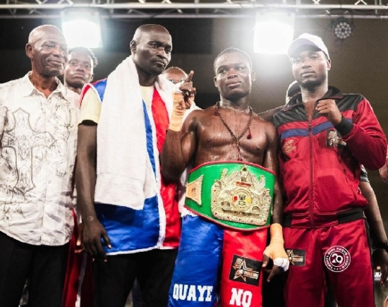 Samuel Quaye celebrates with his manager, Ahmed Nureni-Davis (in red, far right), his trainer Emmanuel Laryea and mentor Yoofi Boham in ring after winning the Ghana super lightweight title in March