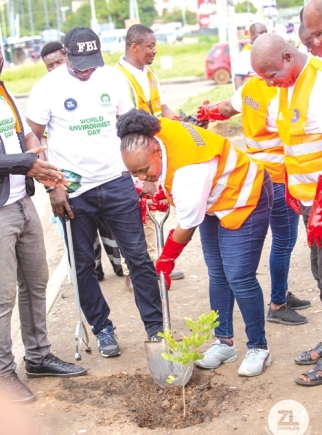 Gloria Opoku-Anti, MD, Zoomlion, planting a tree to commemorate this year's World Environment Day