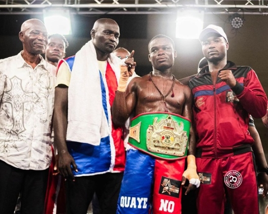 Samuel Quaye (2nd right) with his managers
