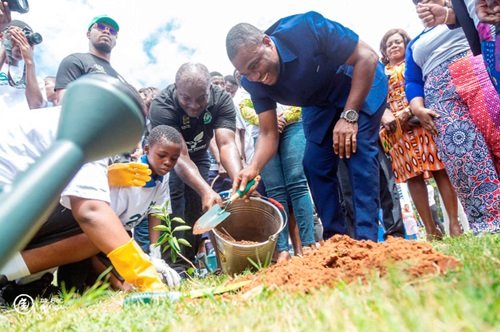 Dr Eric Nkansah, Director-General of the Ghana Education Service, planting a tree at the Labone SHS to mark this year's Green Ghana Day