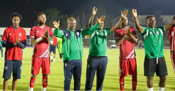 James Kwesi Appiah (3rd from left) and his team responding to cheers after the game