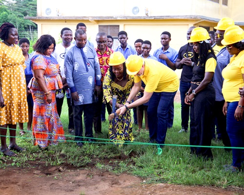 Stephen Blewett (3rd from right), CEO of MTN Ghana, being assisted by Joyce Appiah (4th from left), Headmistress of Aburi Secondary Technical School, to cut the sod for the construction of the MTN Container Project for the School. Looking on are Adwoa Wiafe (2nd from right), Chief Corporate Services and Sustainability Officer, MTN, and some staff and students of the school. Picture: Caleb Vanderpuye
