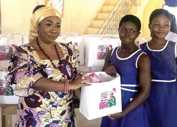  Mama Mornyui Wui II (left), Queen of Sogakope, presenting the items to some of the girls