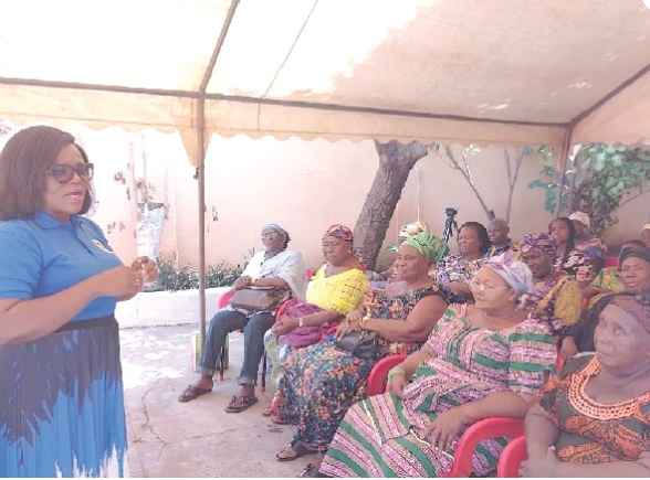 Akosua Danquah Ntim-Sekyere, “See Something Say Something” campaign Team Lead, interacting with the market queens