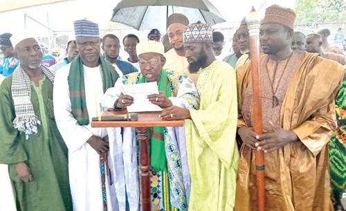 Alhaji Abubakari Adams (middle), the Tema Metropolitan Chief Imam, addressing worshippers at the Eid prayers. Behind him is Yohane Amarh Ashitey, MCE for Tema