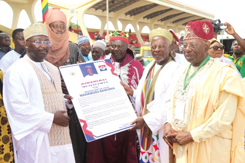 Vice-President Dr Mahamudu Bawumia receiving a citation from Chief Is-hak Sulleman (3rd from right), General Secretary of the National Council of Zongo Chiefs, at the Eid-ul-Adha prayers. With them are other chiefs. Picture: SAMUEL TEI ADANO