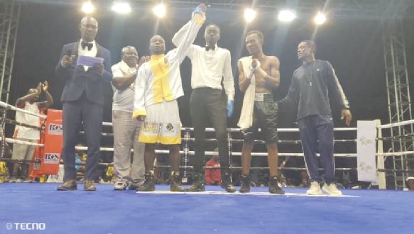 Samuel Martei Laryea (middle) was declared the winner of the bout on Saturday