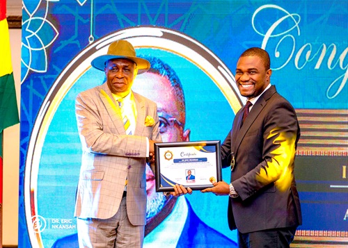 Dr Eric Nkansah (right), Director-General, Ghana Education Service, receiving the award from Austin Gamey, Founder and Chief Executive Officer of PULSE Institute, Africa